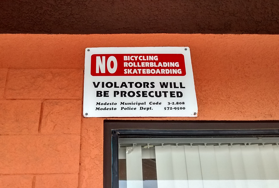 No skateboarding, rollerblading, or bicycle riding sign